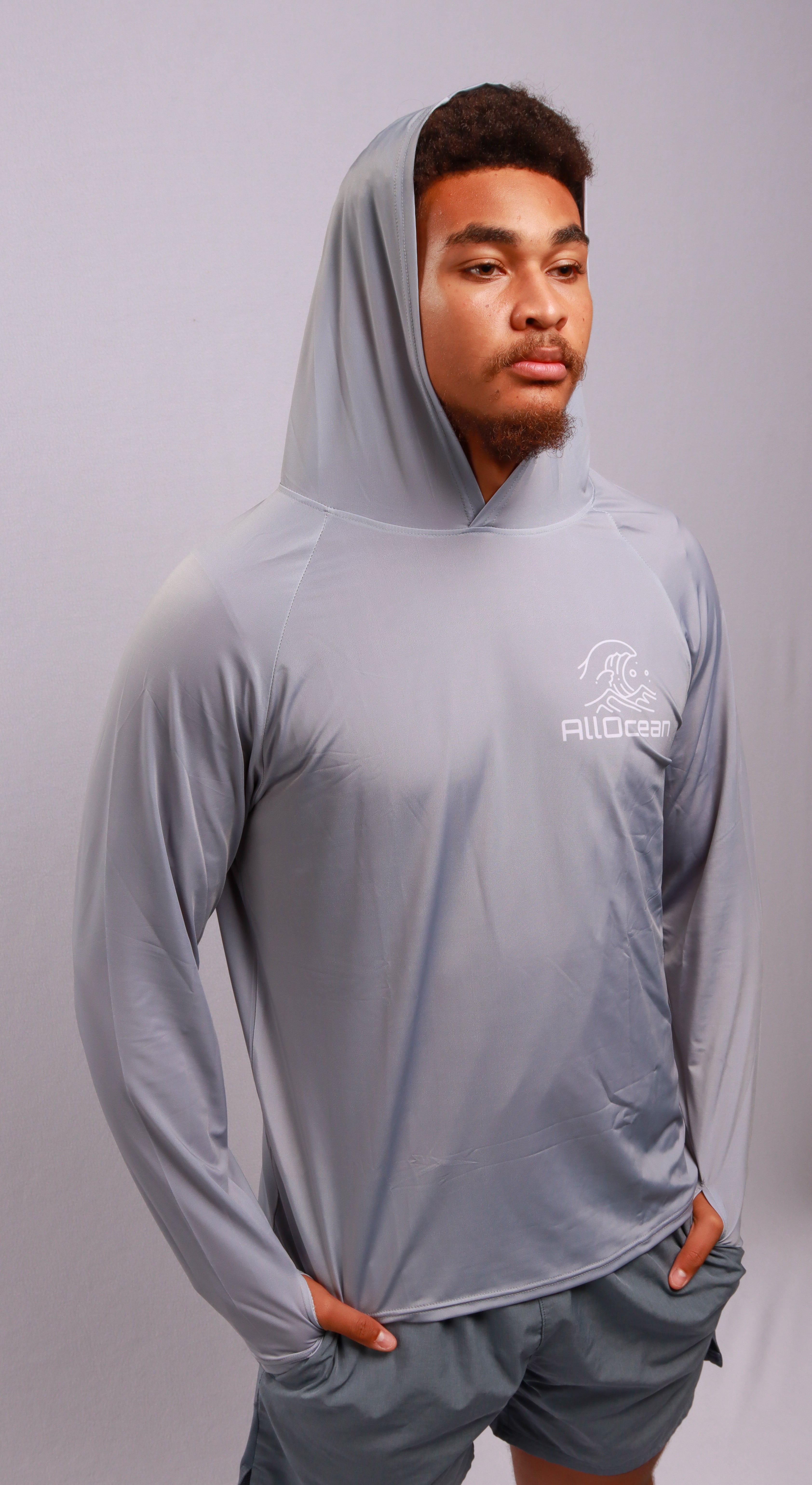  Angler wearing AllOcean Apex Performance Hoodie on offshore boat