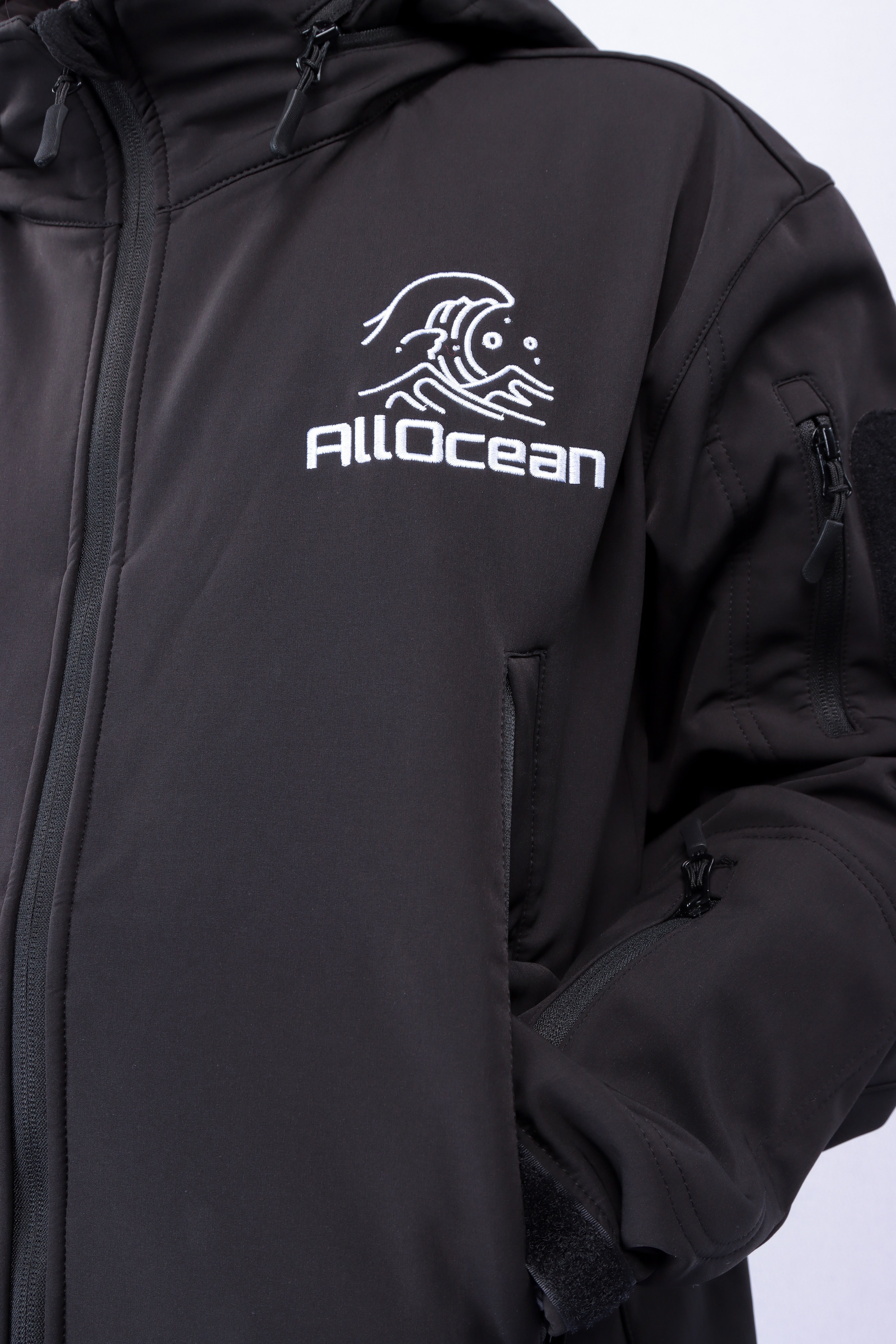 SaltGuard Pro fishing jacket detail showing taped seams and sealed zipper